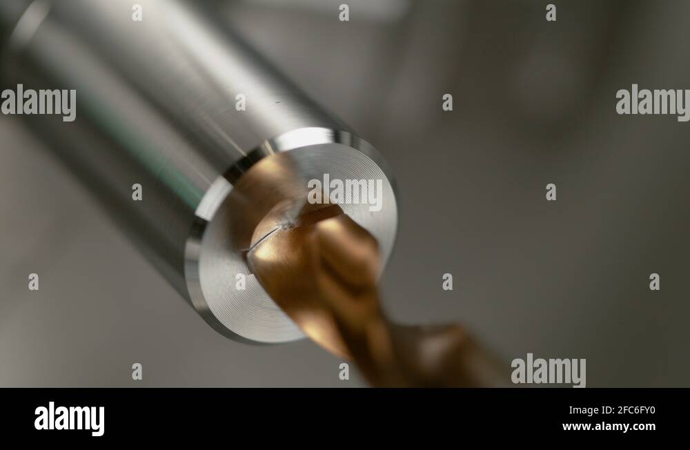 MACRO Lathe tool spot drilling a hole into a cylinder shaped piece of
