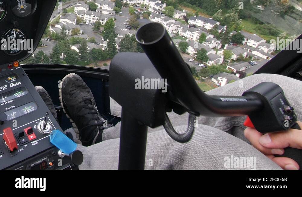 Pilot Controls a Robinson R22 Helicopter over Seattle Suburbs Stock ...