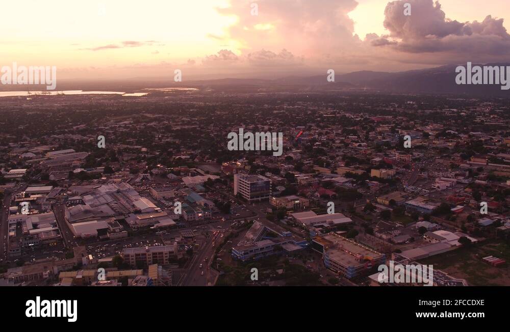 An aerial overview of Kingston, Jamaica. Taken during sunset from above Stock Video Footage Alamy