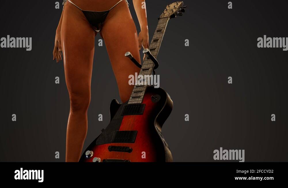 Rock and roll woman with an electric guitar and wearing a bikini Stock