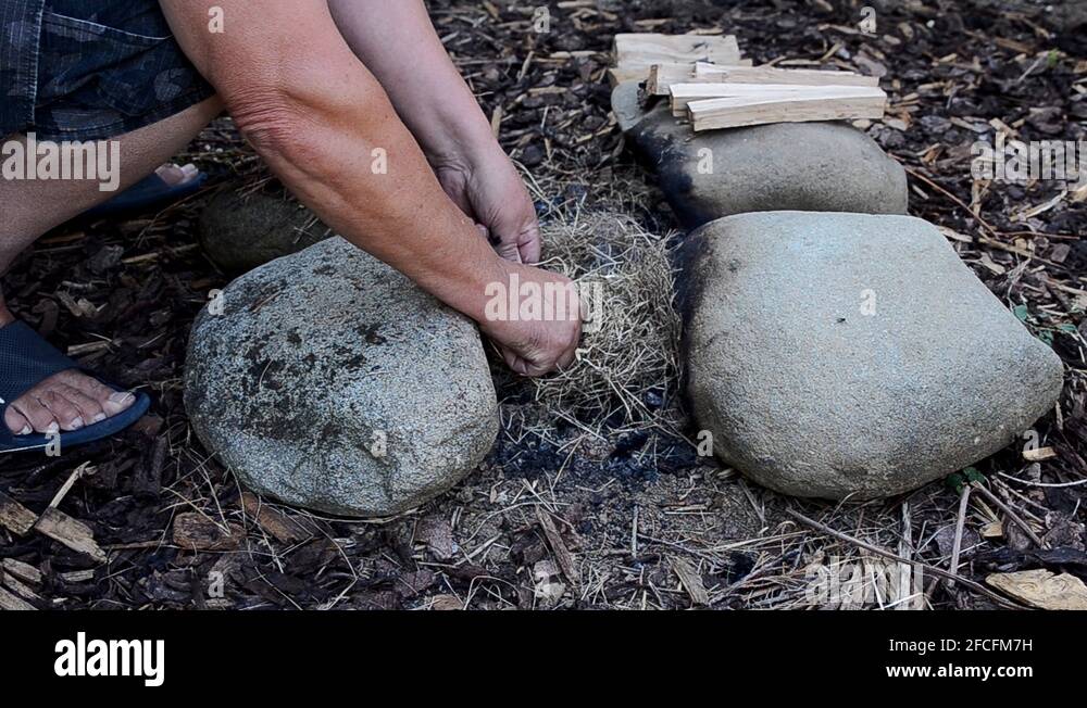 Starting a campfire with magnesium flint steel and dry grass straw