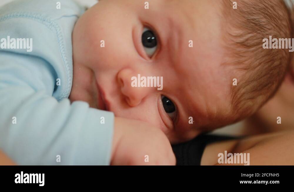Baby falling asleep on mother chest together afternoon nap Stock Video
