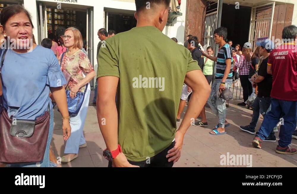 Church goers in and out of the catholic church Stock Video Footage Alamy