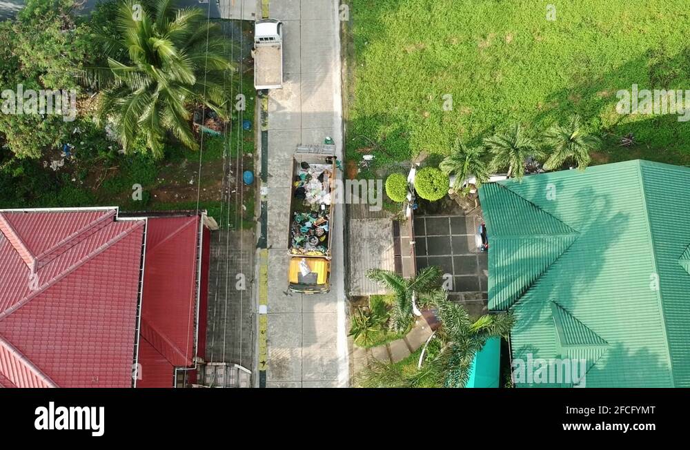 Garbage Truck on Garbage Collection Day, Quezon City, Philippines Stock