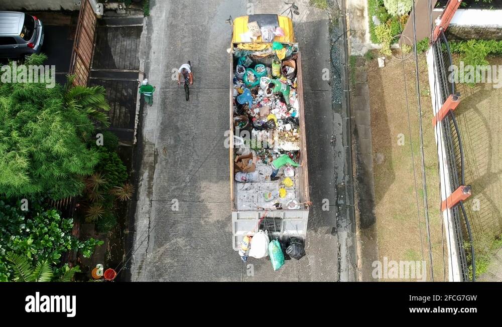 Garbage Truck on Garbage Collection Day, Quezon City, Philippines Stock