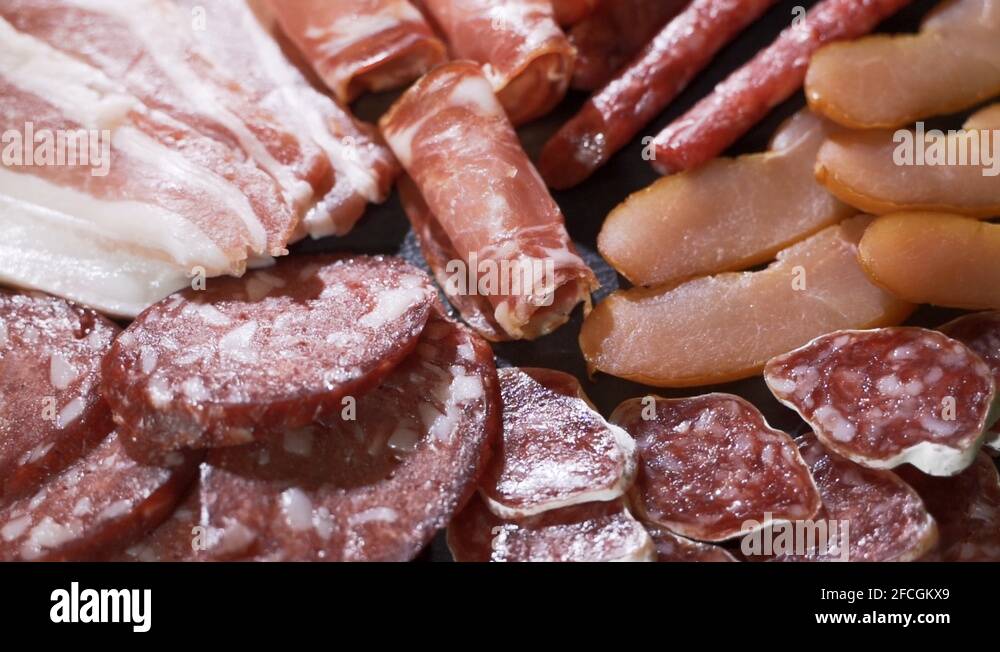 Different types of dry sausages on plate Stock Video Footage Alamy