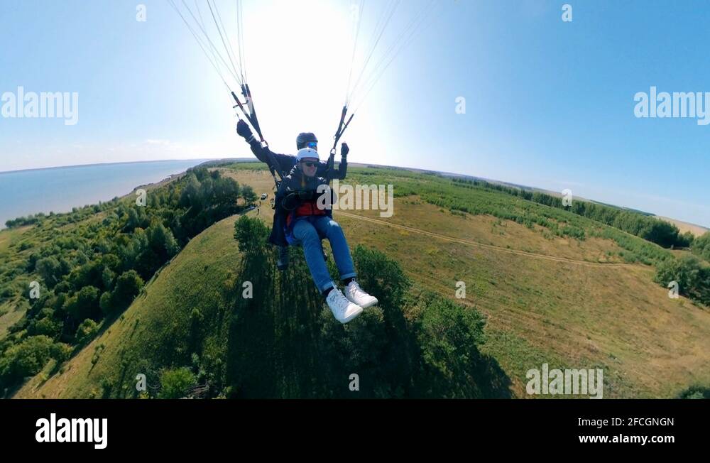 People gliding in the sky with a paraplane Stock Video Footage Alamy