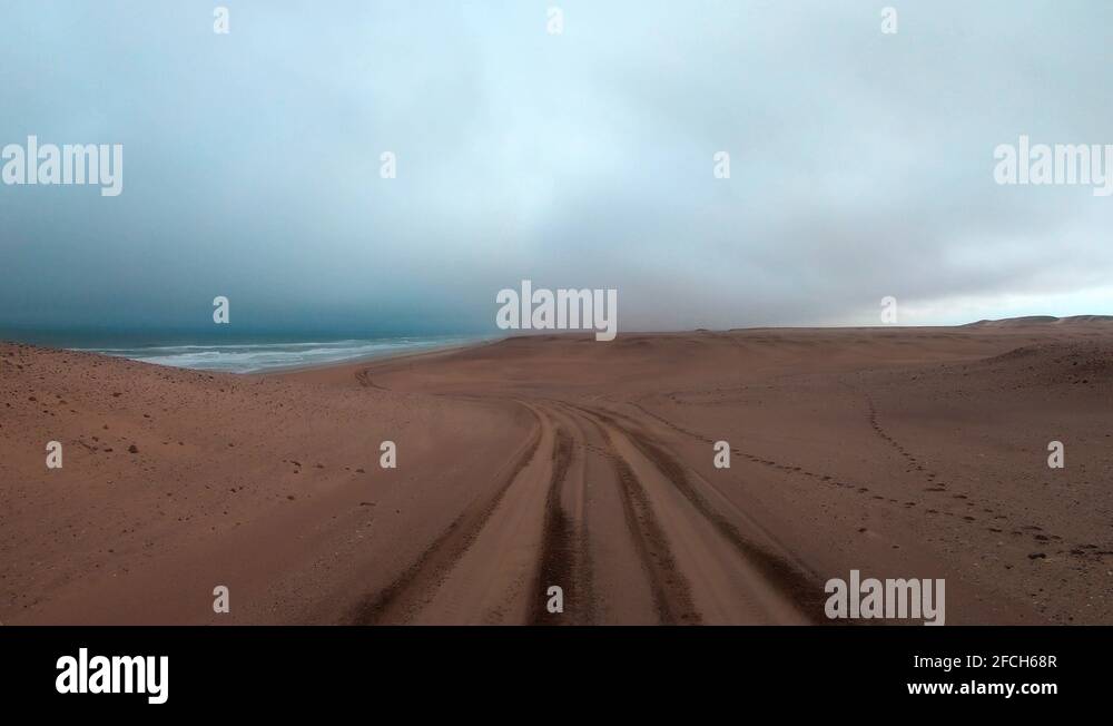 FPV of dune riding and 4x4 driving in sand dunes and on the beach. Shot