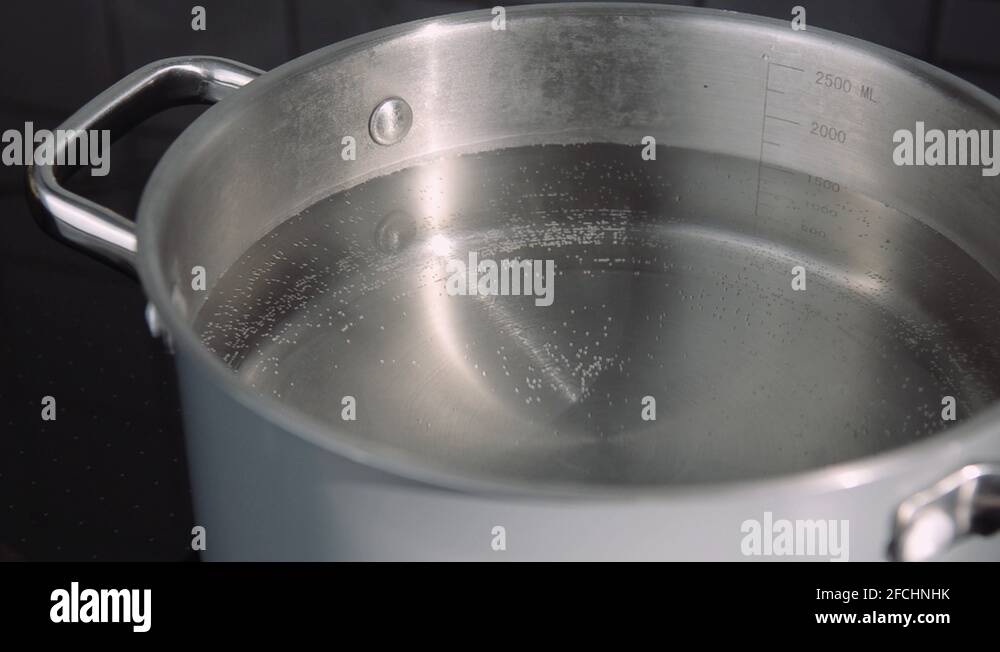 escalated pot filled with steaming hot boiled water Stock Video Footage
