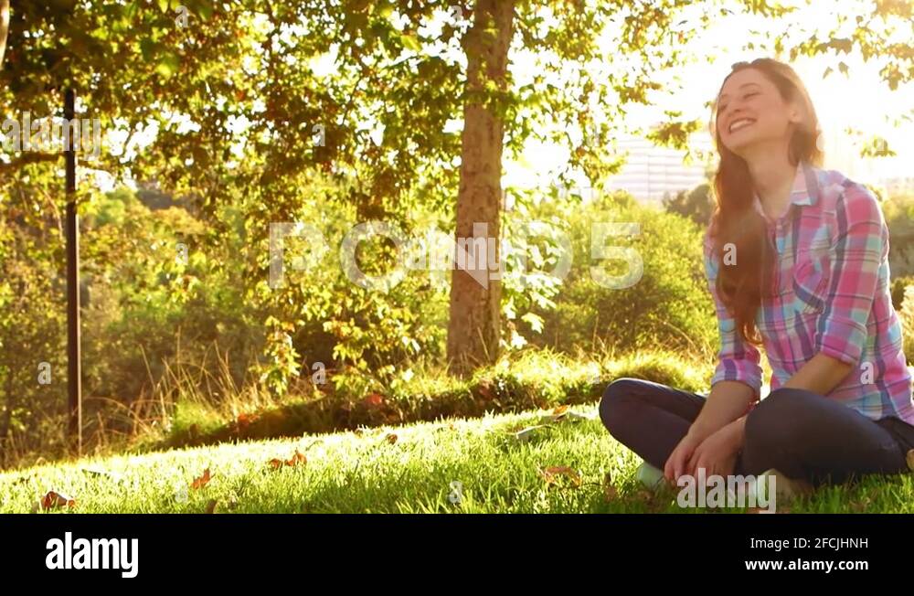 Woman sitting cross legged outdoors Stock Videos & Footage HD and 4K