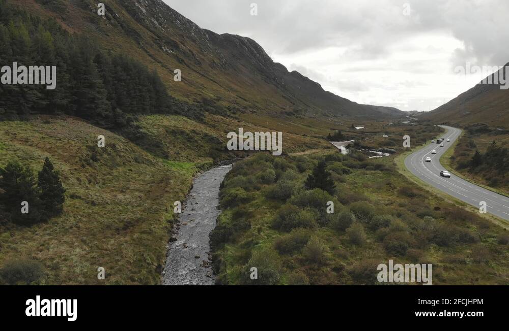 Barnesmore Gap, mountain pass with valley and bandy river and road next to Stock Video Footage