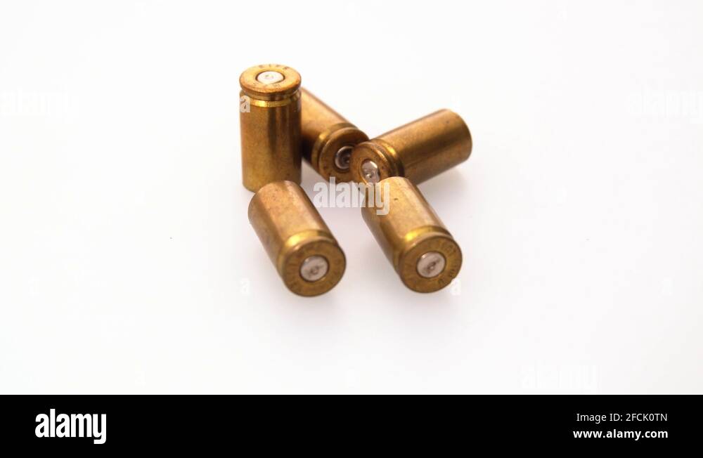 Used rustic 9mm pistol bullet shell casing rounds on a white background
