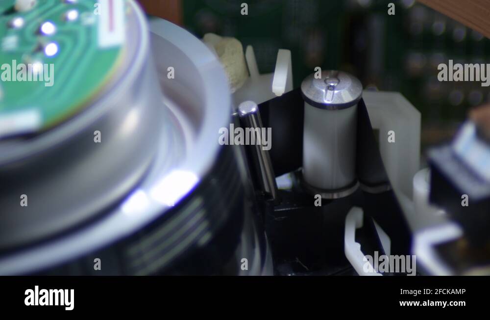 Tape passing by vhs video helical head reading the cassette film Stock ...