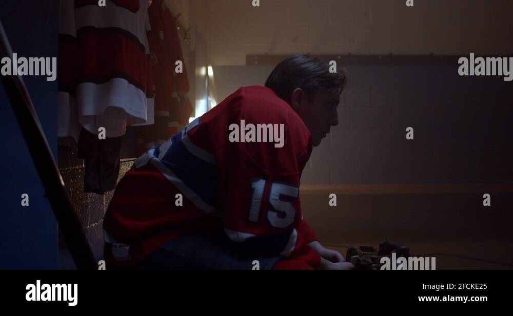 Hockey player in dressing room ready for game Stock Video Footage Alamy
