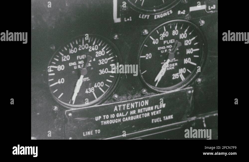 1950s Fuel tank gauges in airplane cockpit. Airplane flies low over water Stock Video Footage