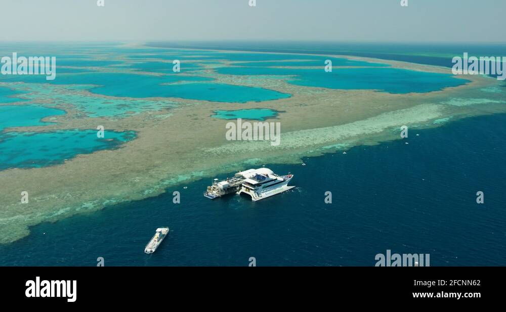 Sunrise aerial floating pontoon Whitsundays Great Barrier Reef Stock