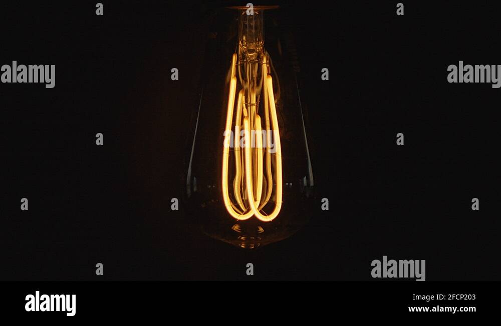 Vintage lightbulb dimming on and off. Filmed in 4k Stock Video Footage ...