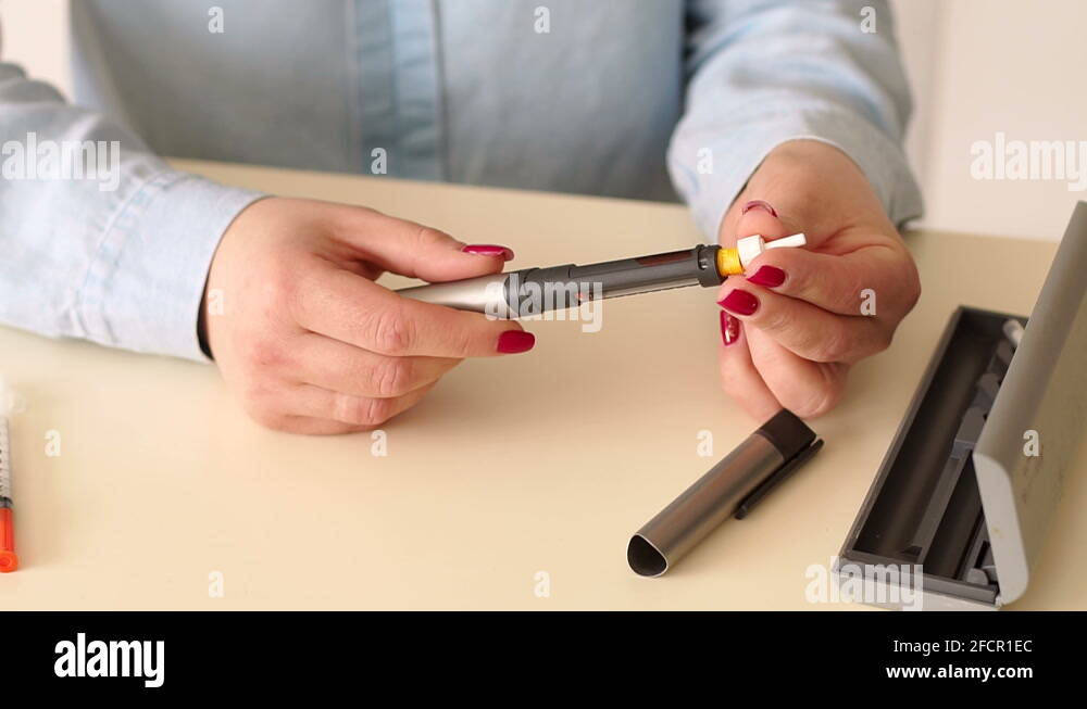 Girl inserts a cartridge of insulin in a syringe insulin pen Stock Video Footage Alamy