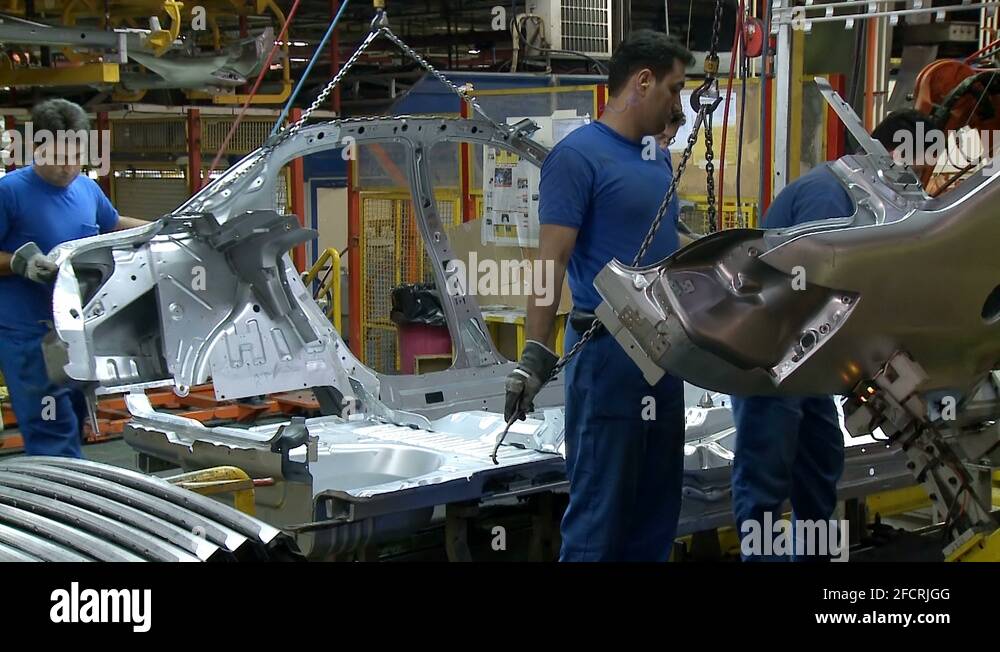 Workers assemble body parts inside Khodro car factory, Tehran, Iran