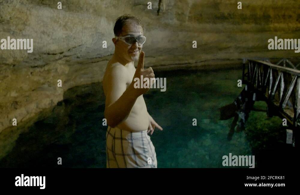 Man swimming inside Cenote lagoon underground in Mexico Stock Video ...