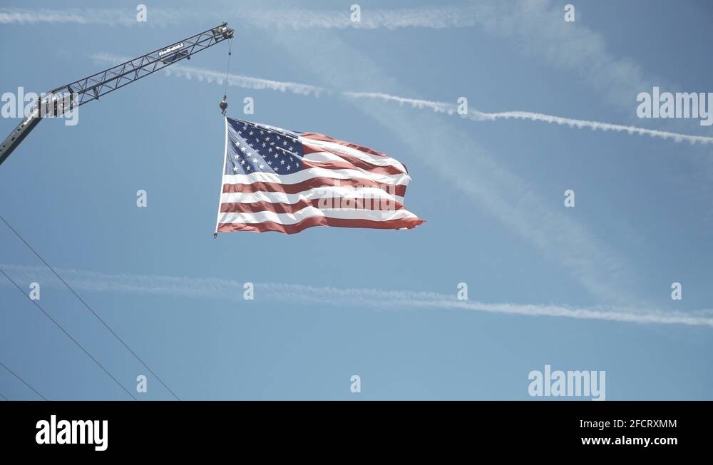 American flag hanging from crane Stock Videos & Footage HD and 4K