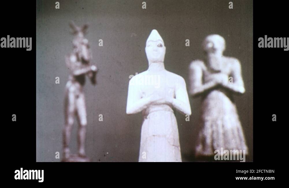 1950s Sumerian statues, man with beard, large eyes, hands clasped at