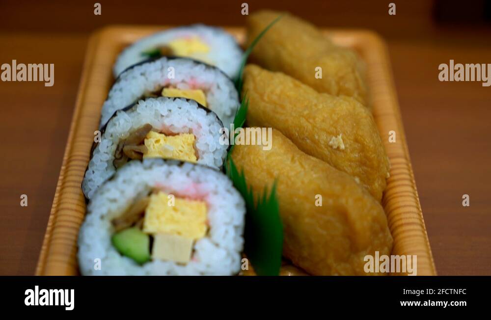 sweet egg sushi roll with fried tofu Japanese food style Stock Video