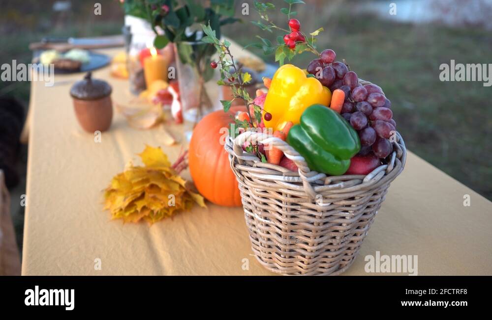 Overview of decorated picnic table with seaside on blurry background