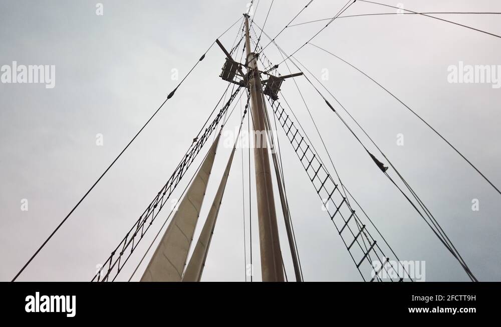 Vintage sailing boat rig with old school sails, lines, halyards rigging