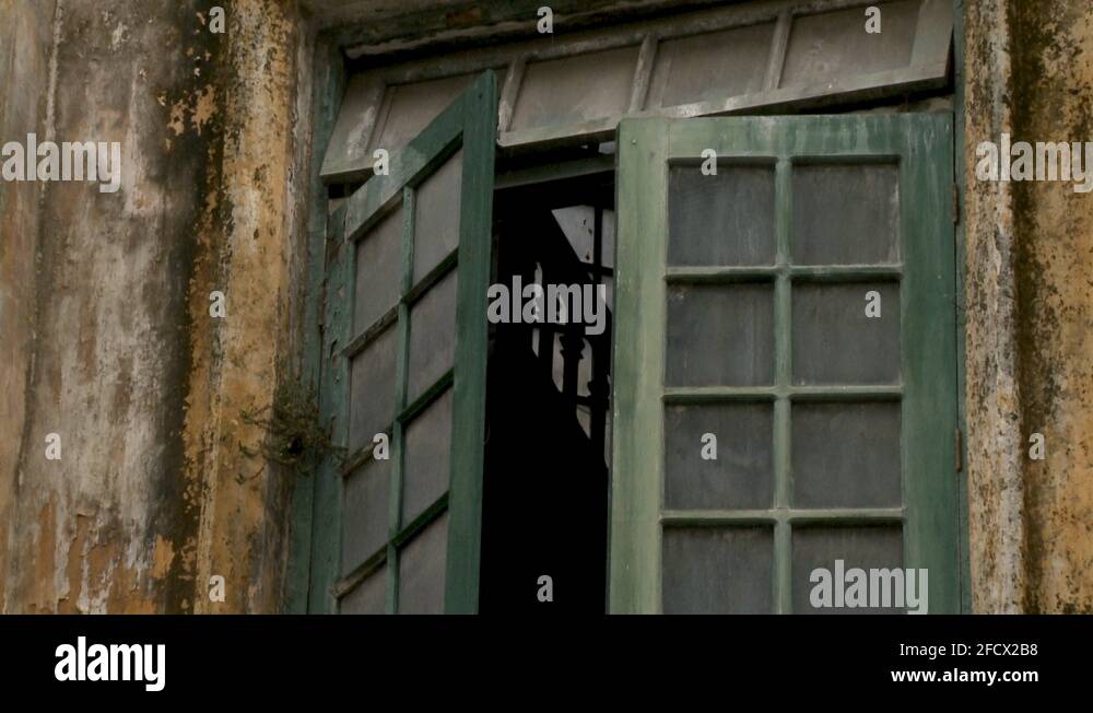 A house with a dingy facade and paneled windows Stock Video Footage Alamy