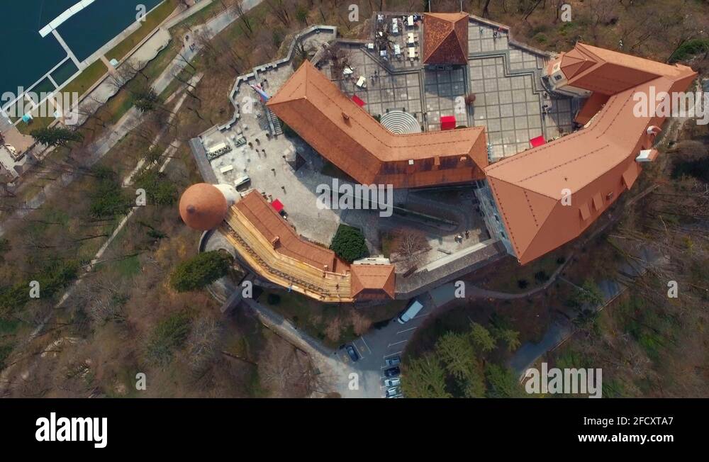 Drone forward bird eye flying view of lake Bled castle on cliff Stock ...