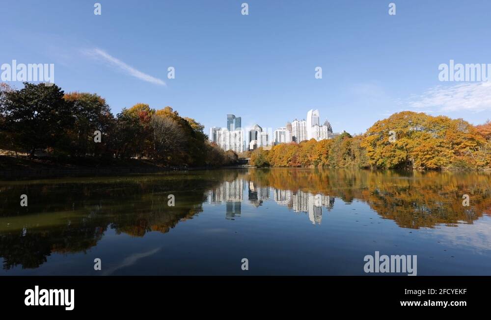 Serene view of the Atlanta skyline from Piedmont Park's Reflection Lake
