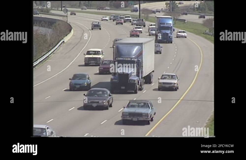 1990s UNITED STATES traffic on highway. Special surface on highway