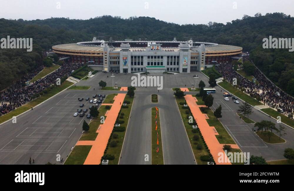 Pyongyang Football Thousands of spectators exit Kim Il-Sung Football Stadium. Pyongyang ...
