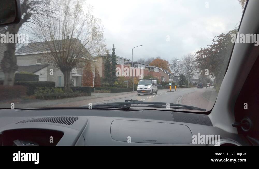 POV of inside the car at the passenger seat. Driving at the road in