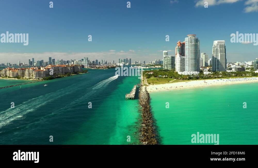 Drone rising Miami Beach Government Cut inlet Fisher Island Stock Video