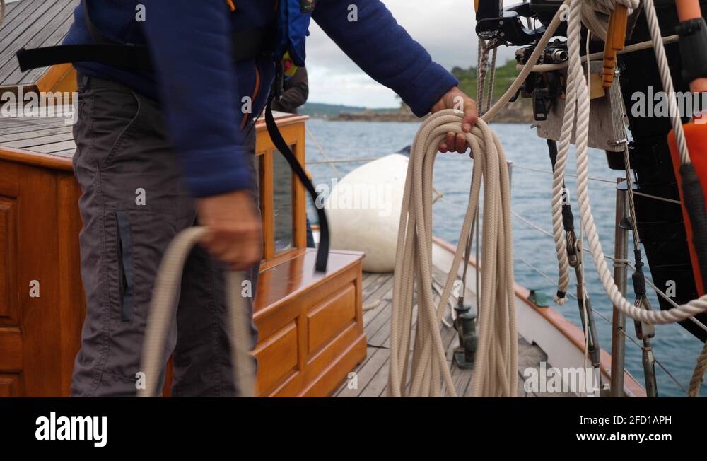 Sailor Coiling a Halyard on a Classic Boat Stock Video Footage Alamy
