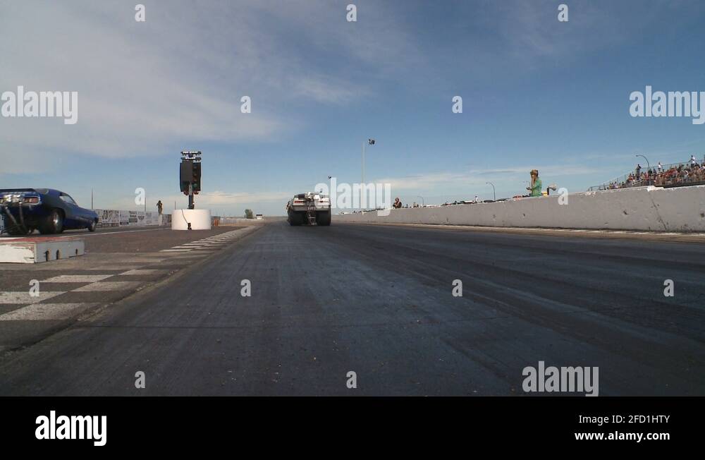 motorsports, drag race Nostalgia funny car in reverse Stock Video