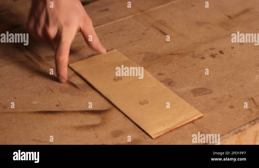 Laying down different types of sandpaper with different levels of grit