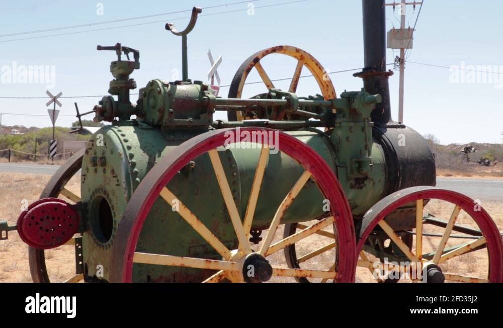 old steam tractor with big metal wheels in the midlle of the desert Stock Video Footage Alamy