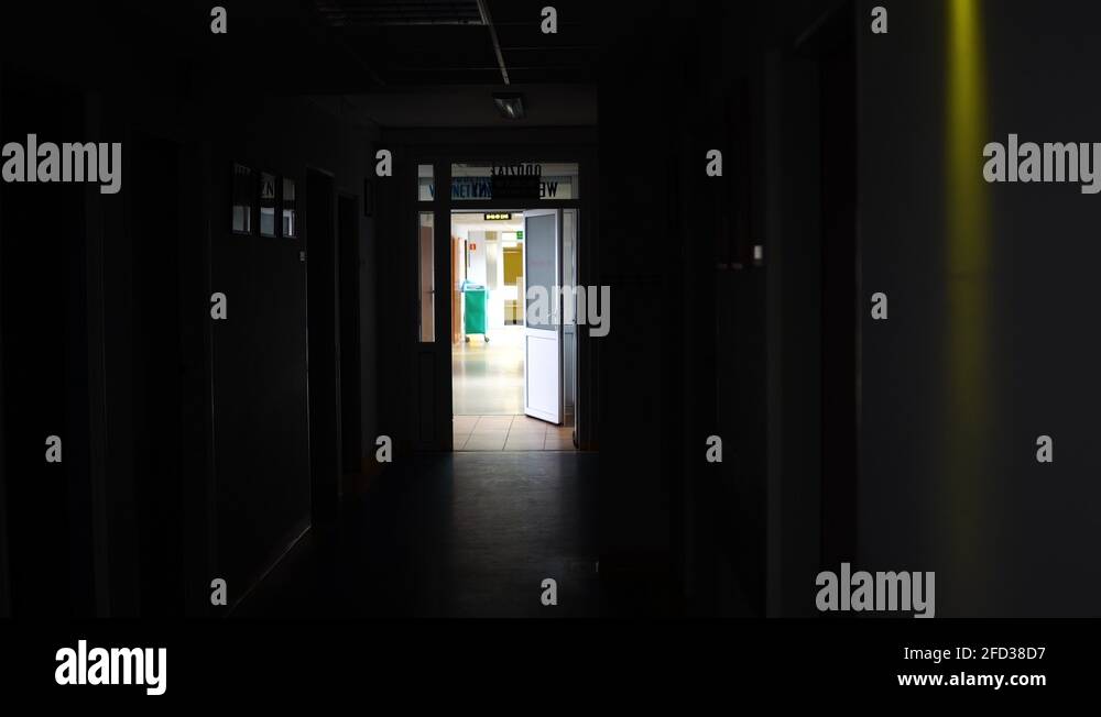 Static, top view Empty dark hallway, light on the end, place inside Stock Video Footage Alamy