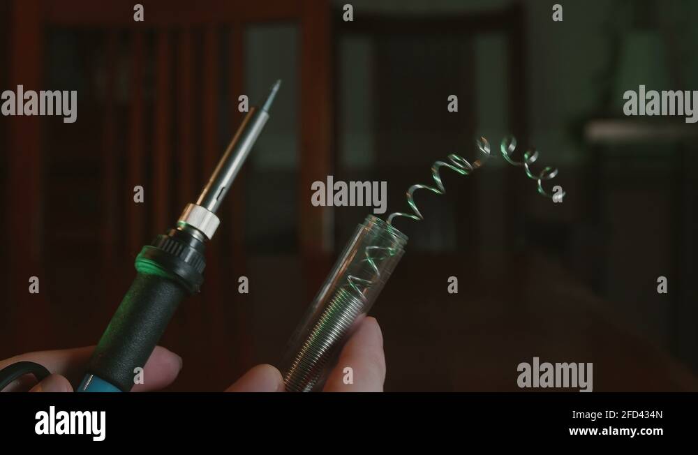 holidng soldering iron up Stock Video Footage Alamy