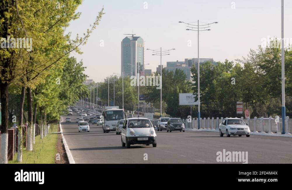 Highway in Tashkent, Uzbekistan. Cars, Busses, Towers and blue sky Stock Video Footage Alamy