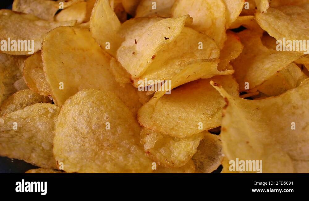 Potato Chips Fast Food Stack Pile of Chips Unhealthy Snack on rotating