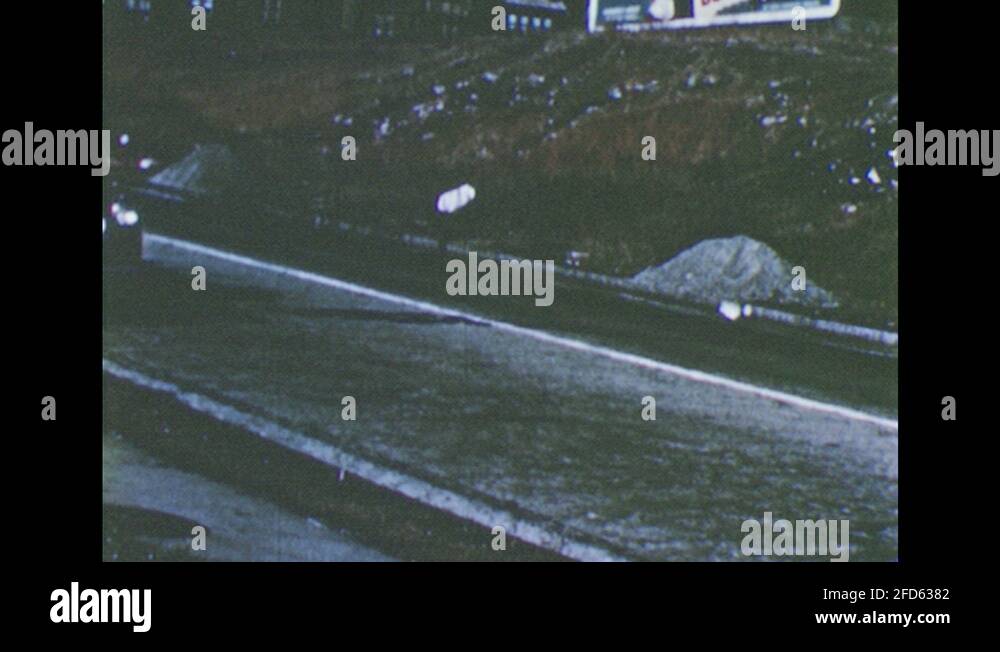 1950s: car pulling over on the side of the road, putting on the ...