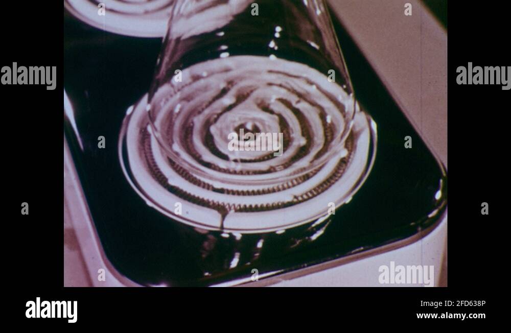 1960s UNITED STATES glass beaker on electric hot plate. Air in bottle