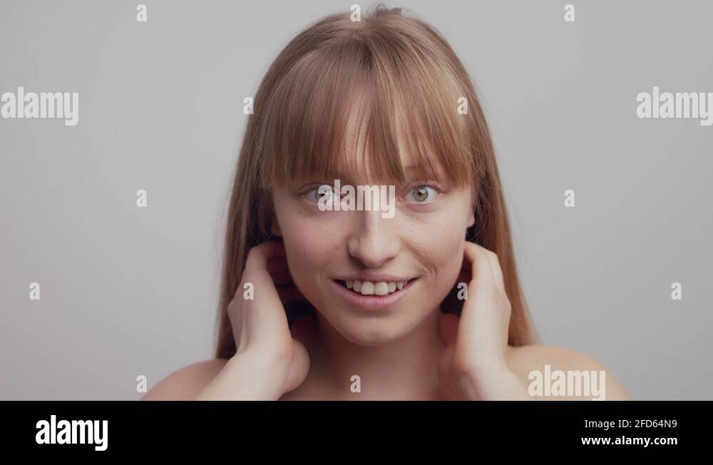 Polish woman expressing her personality by flipping her hair in slow
