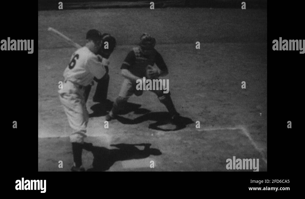 1940s Batter, referee and catcher at home plate. Catcher catches pitch and Stock Video Footage