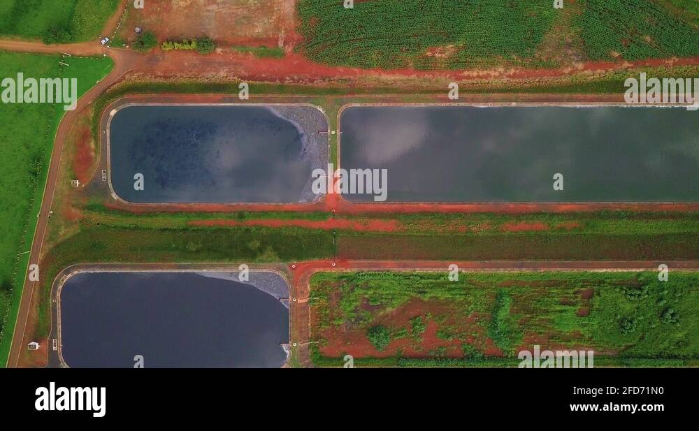 Aerial view of sewage treatment plant, several pools to treat water