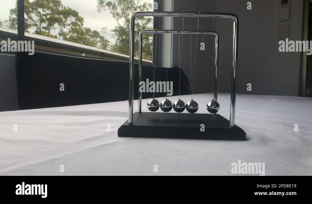 Newtons Cradle Steel Balls Pendulum Stock Video Footage Alamy